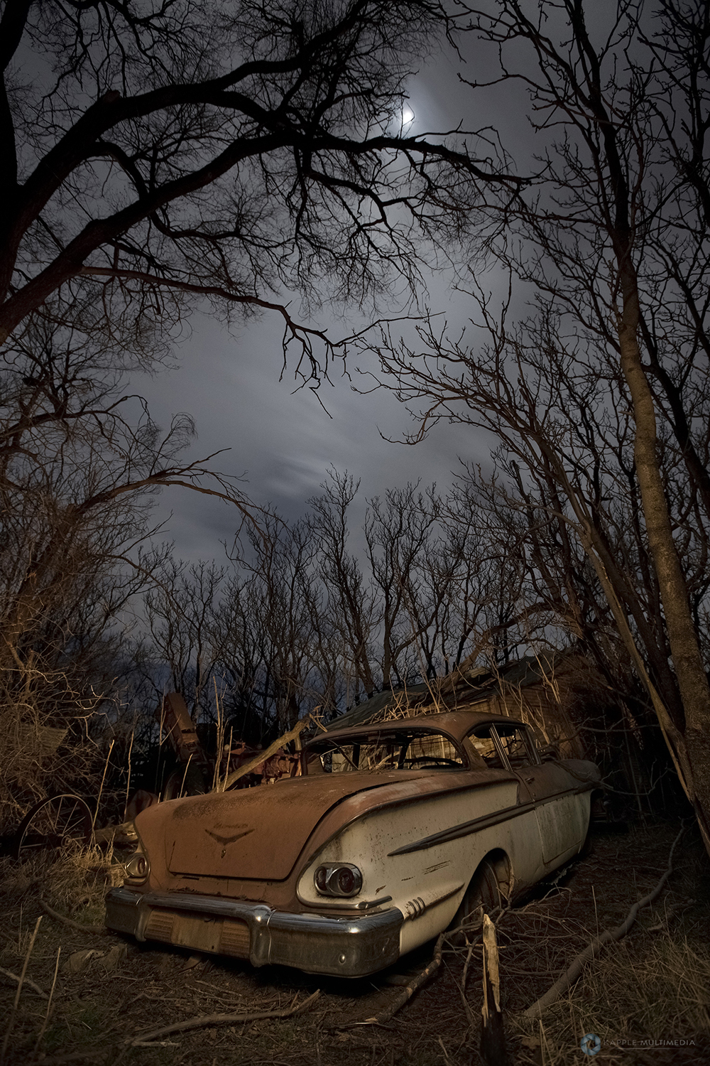 Old abandoned farm house and car