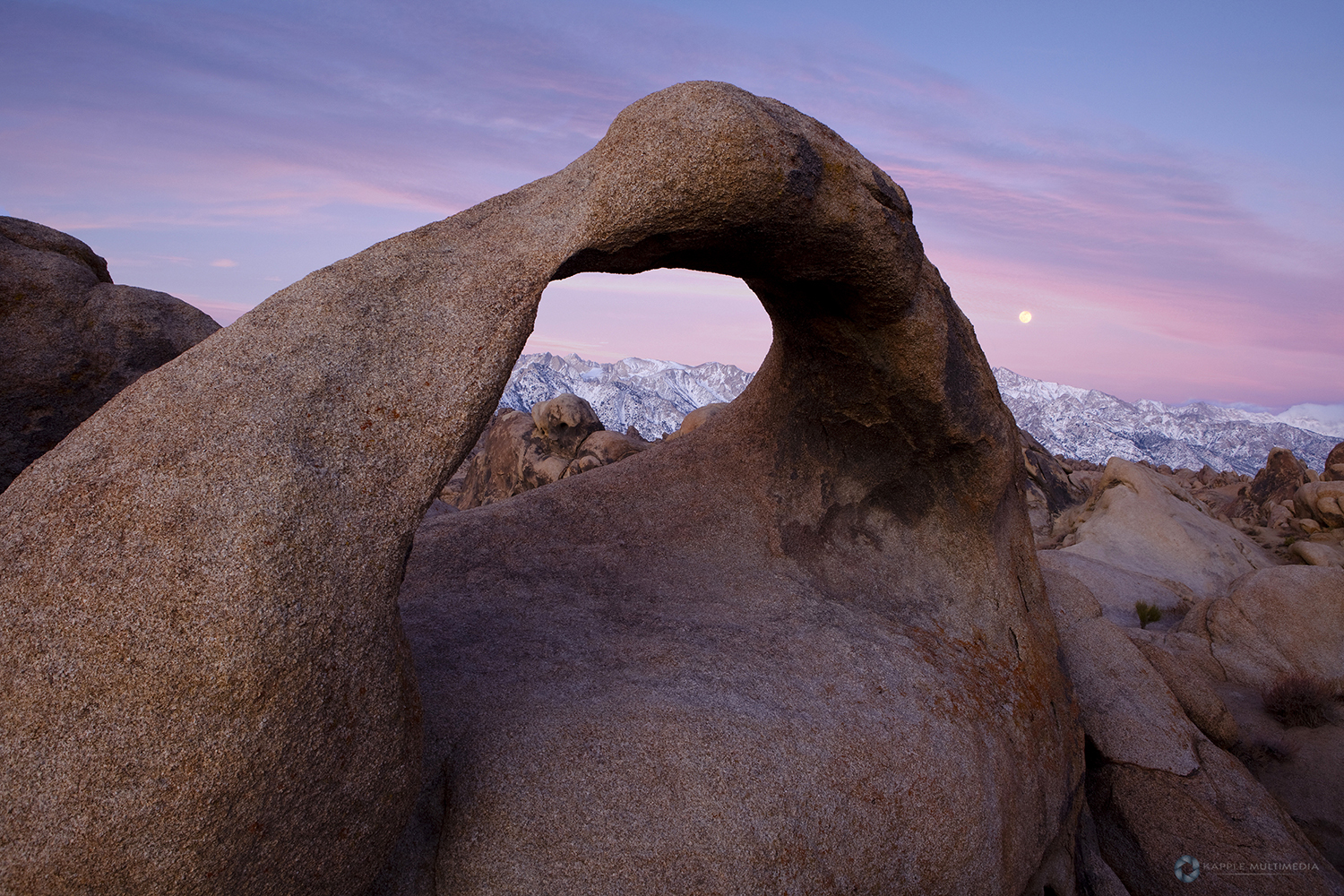 Sunrise at Mobius Arch in the Alabama Hills with the Sierras in the background. Alabama Hills, Lone Pine, California, USA.