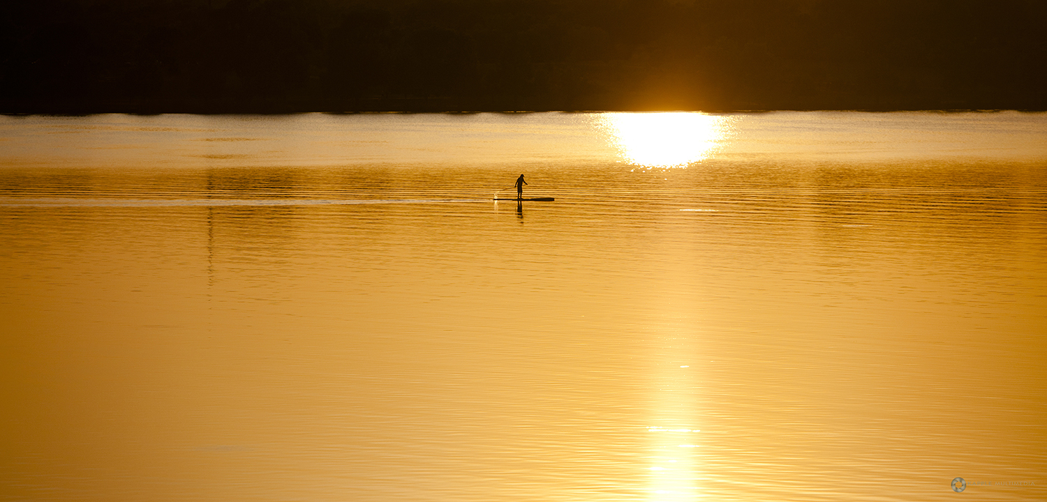 Lone Kayaker during sunset at White Rock Lake, Dallas, Texas